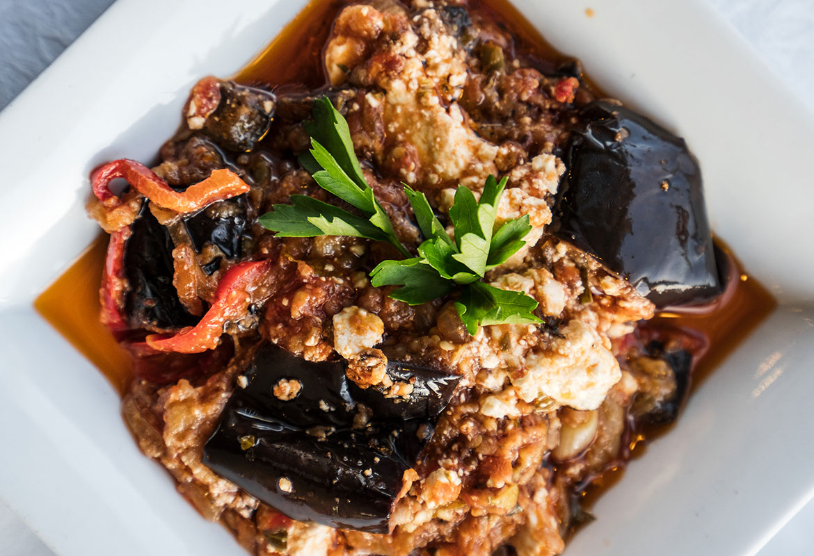 Aubergines cooked with tomato and feta